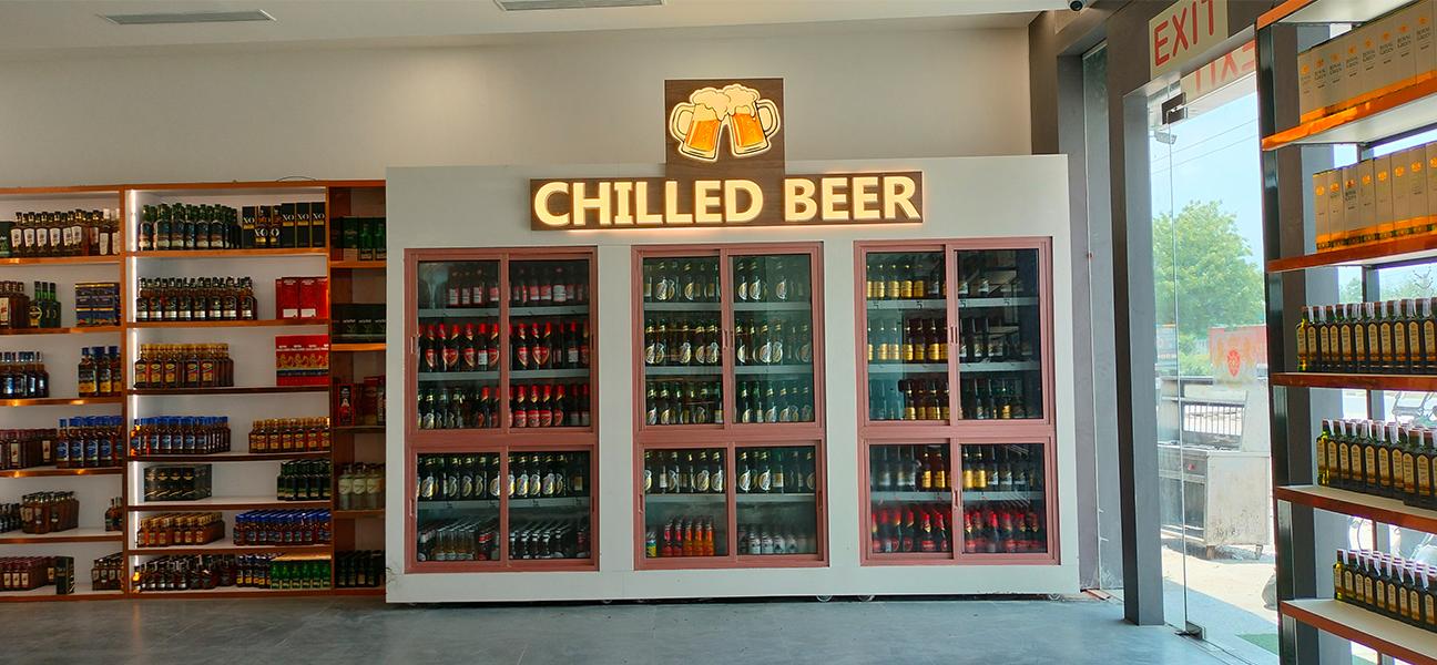 Woodnote Brand Shop Bahadurgarh retail liquor store interior by Next BC